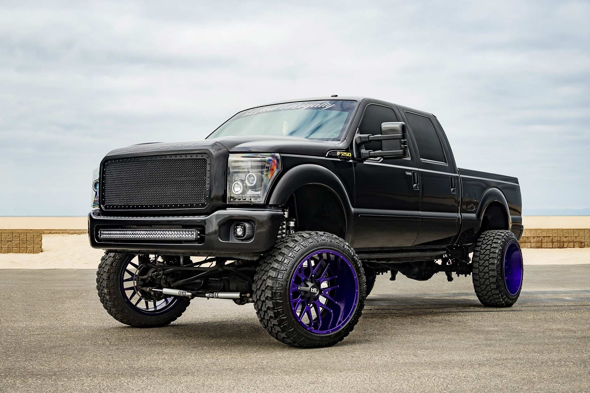 black ford f-250 with custom purple finish hardrock h700 truck wheels