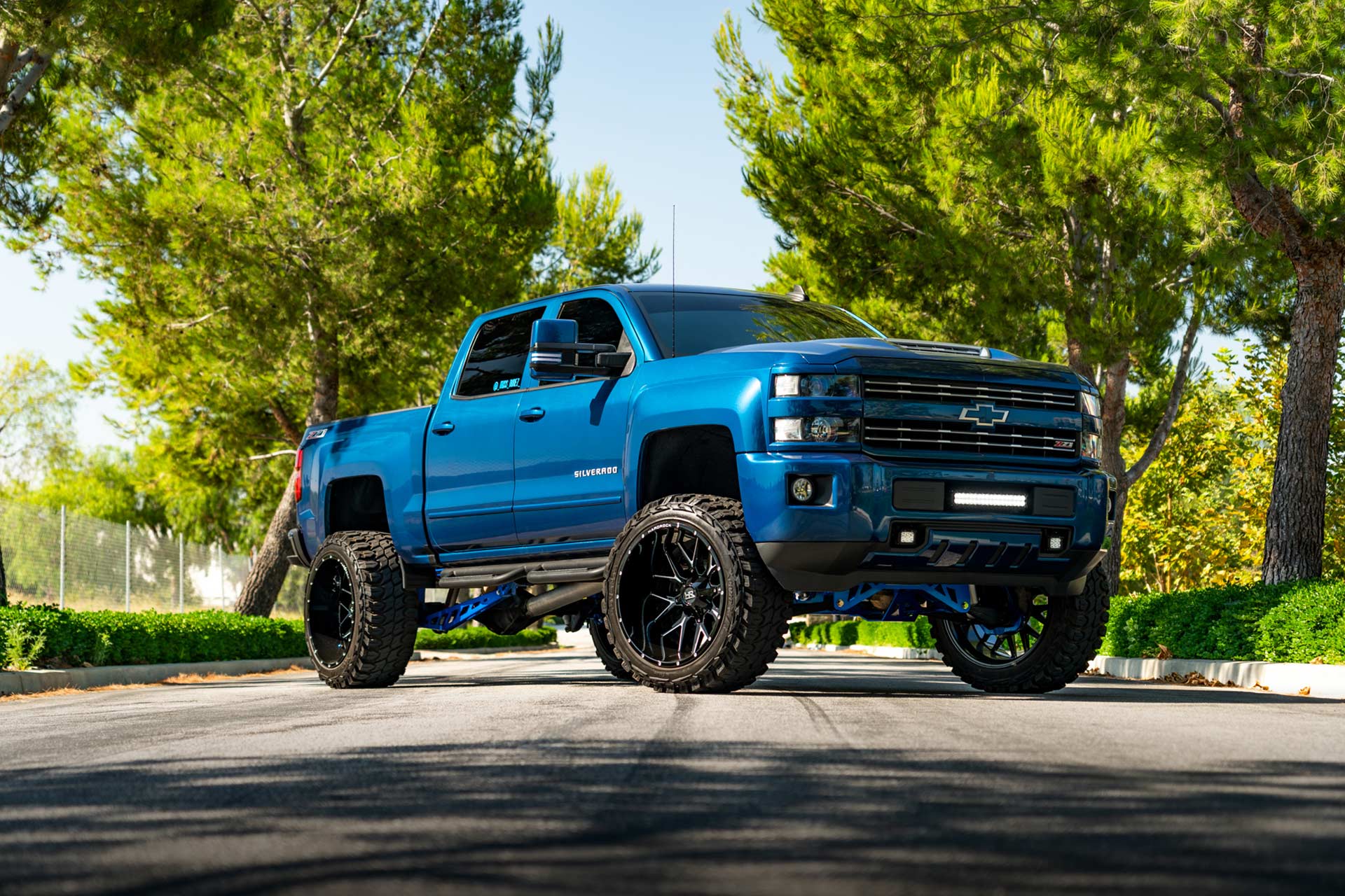 blue chevy silverado 1500 z71 with gloss black milled hardrock h700 truck wheels