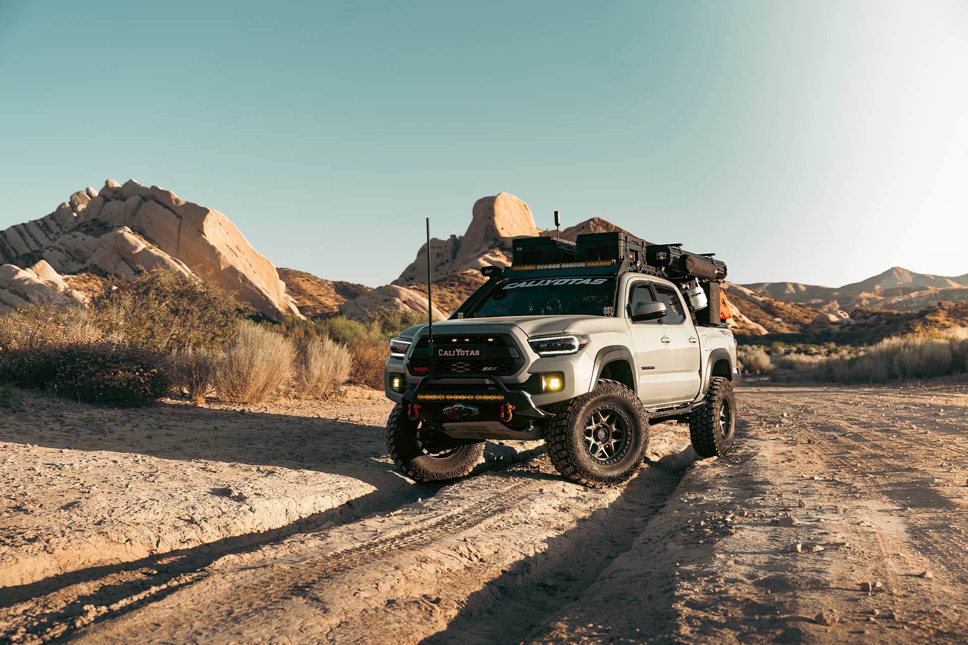 cement gray toyota tacoma with matte bronze hardrock h107 off road wheels