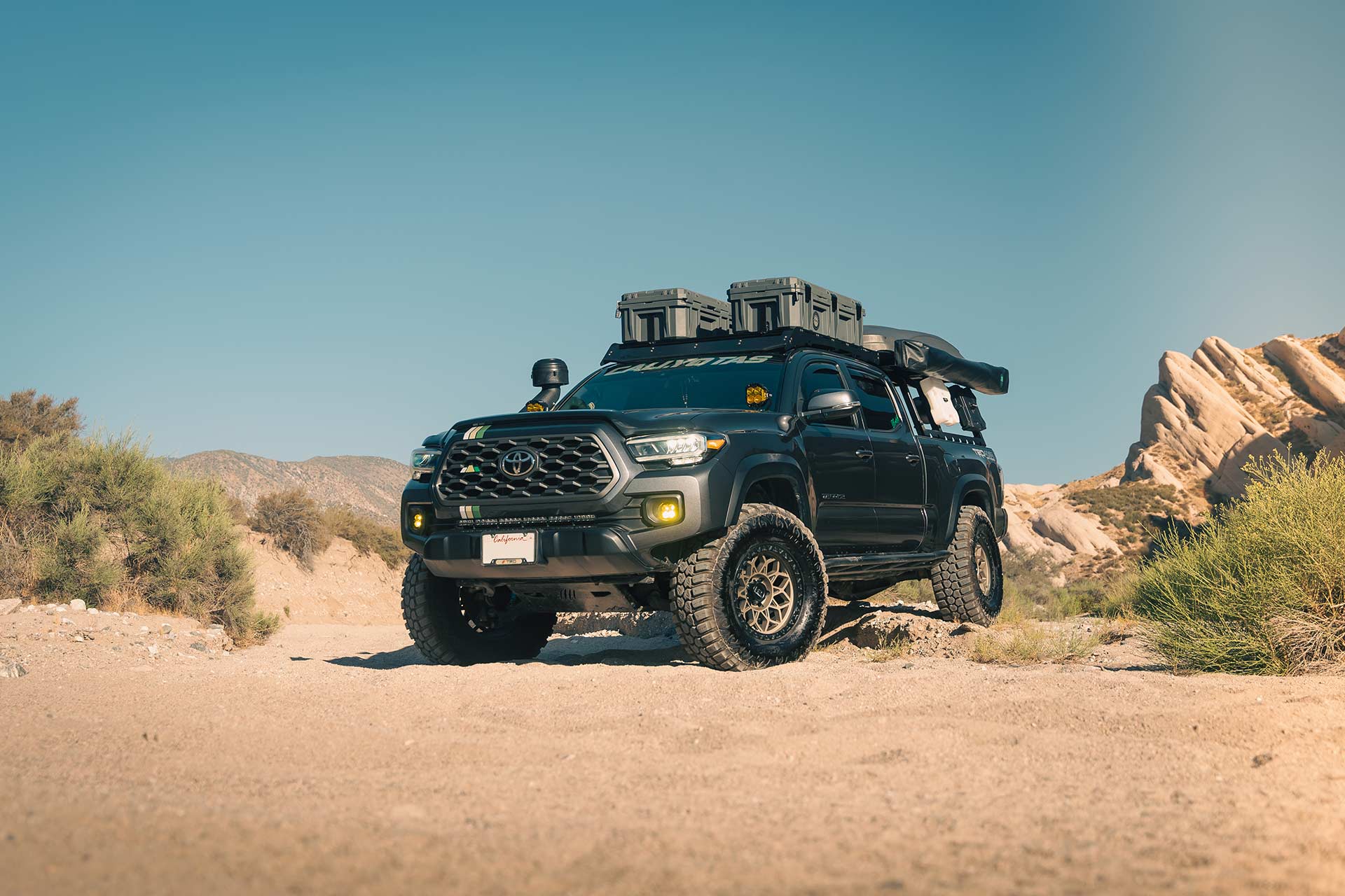 gray toyota tacoma with matte bronze hardrock h108 off road wheels