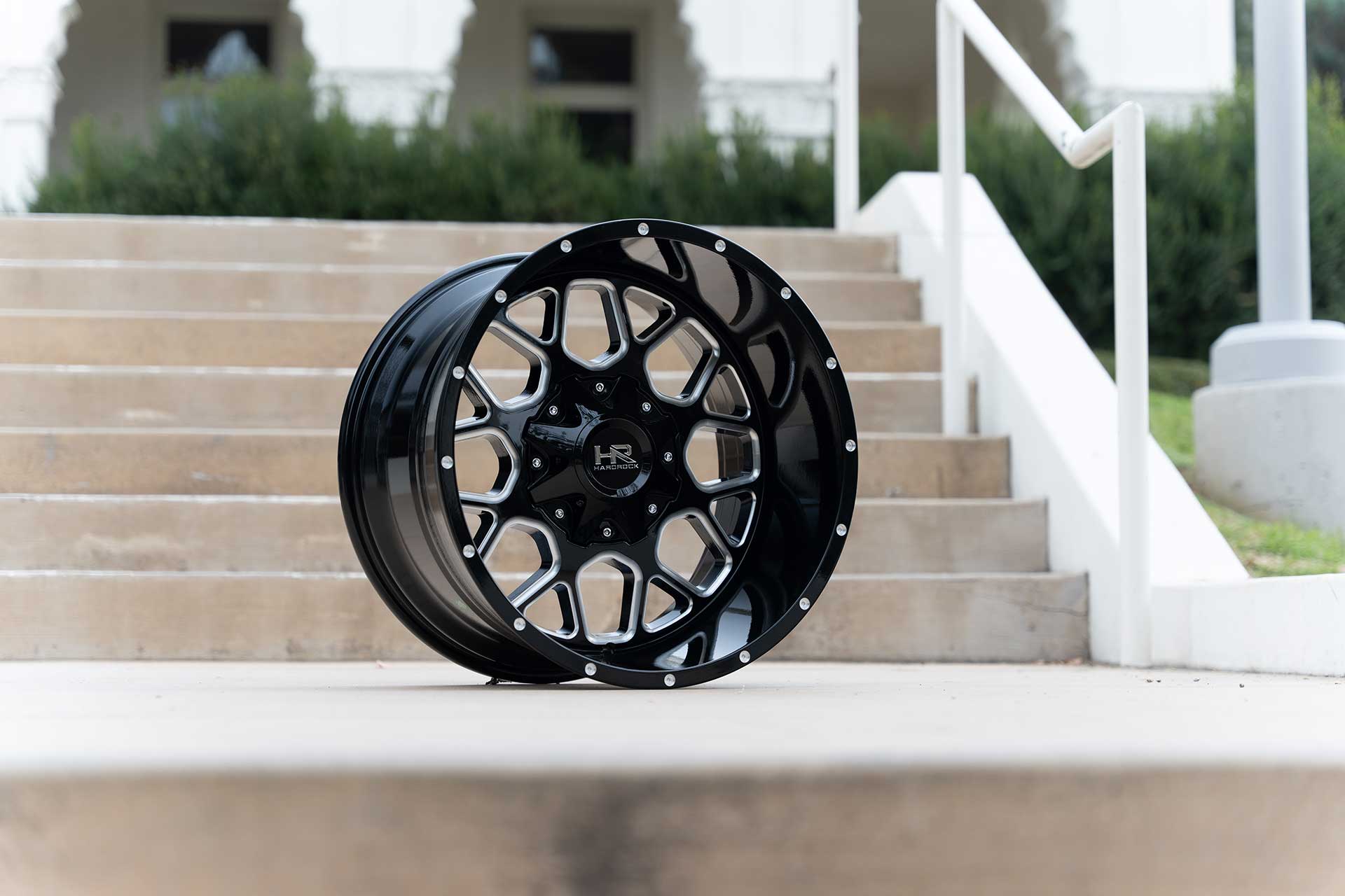 gloss black machined hardrock offroad h705 on concrete staircase