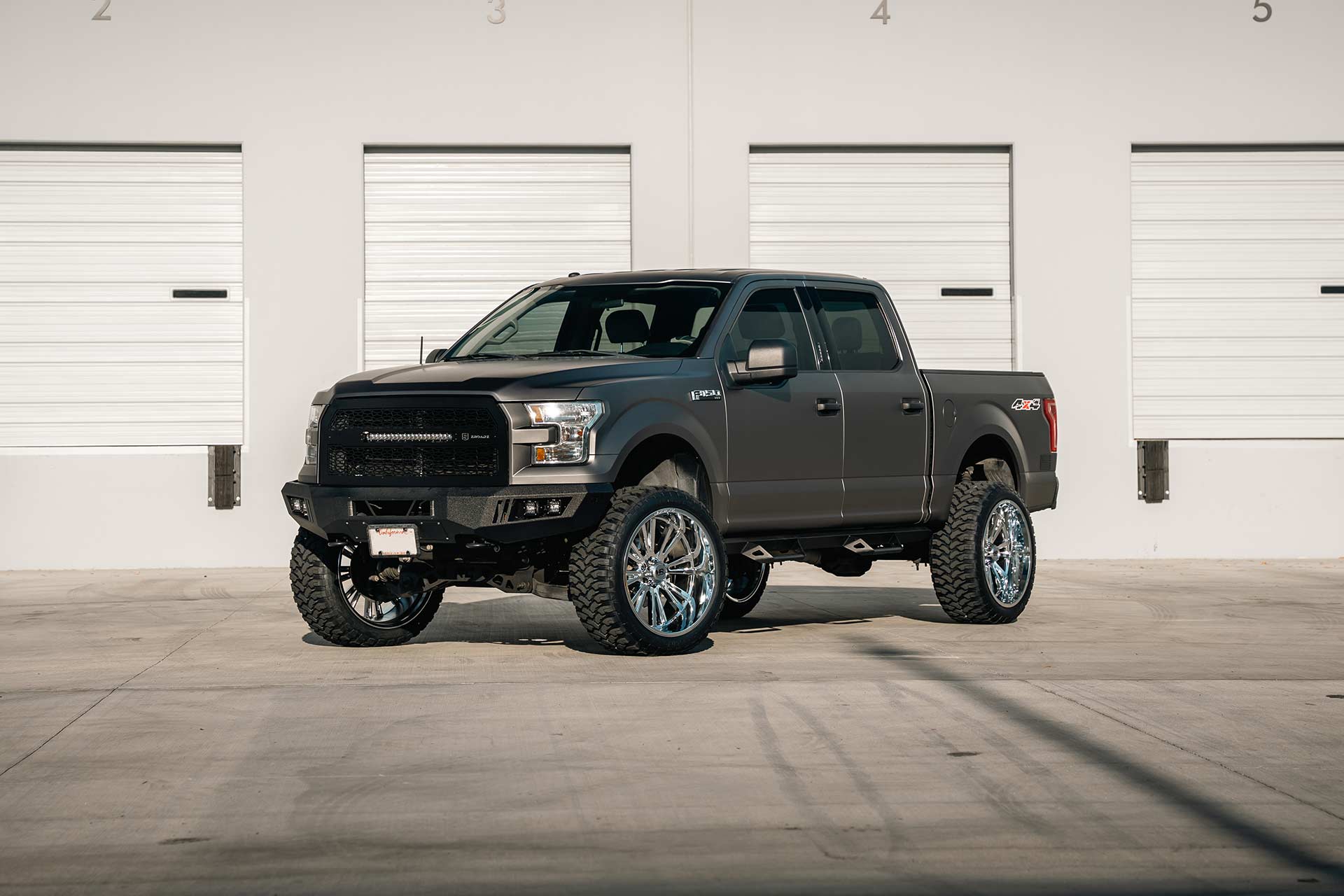 matte gray ford f-150 xlt with chrome hardrock h503 off road wheels