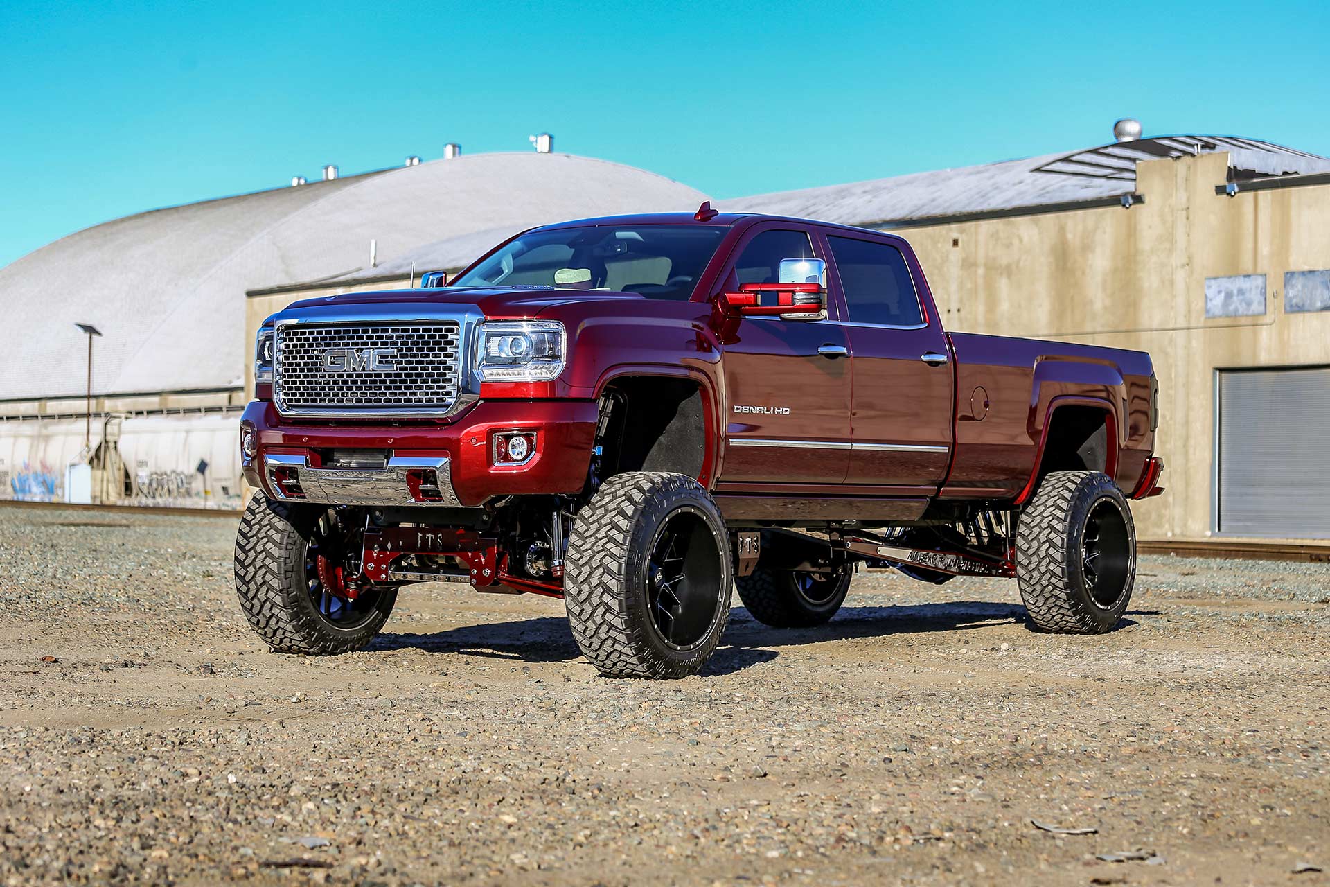 red gmc sierra 3500 with gloss black milled hardrock h700 truck wheels