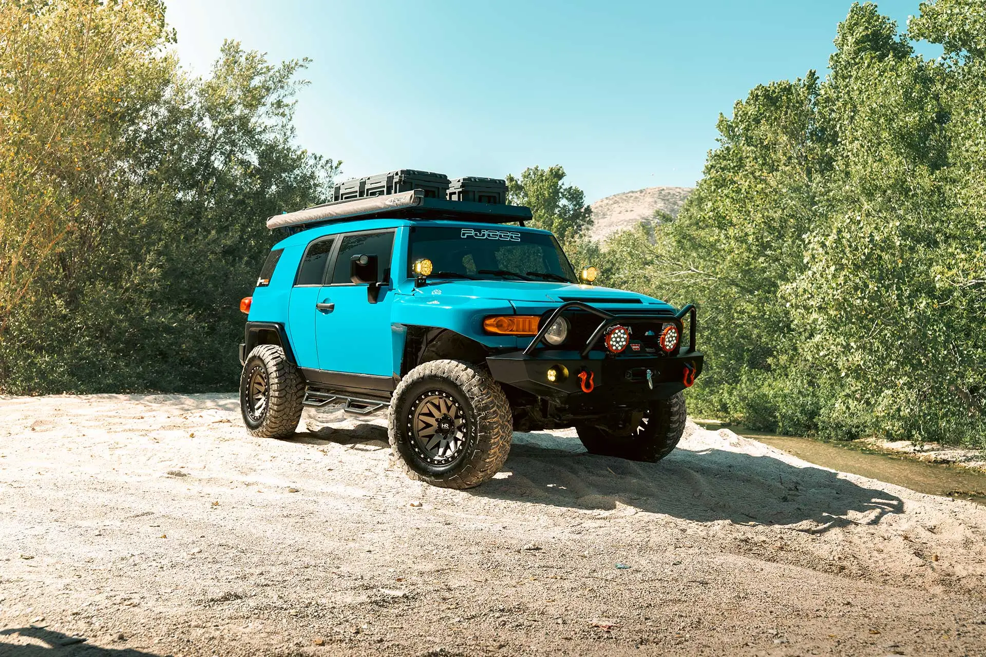voodoo blue toyota fj cruiser with matte bronze h106 off road wheels