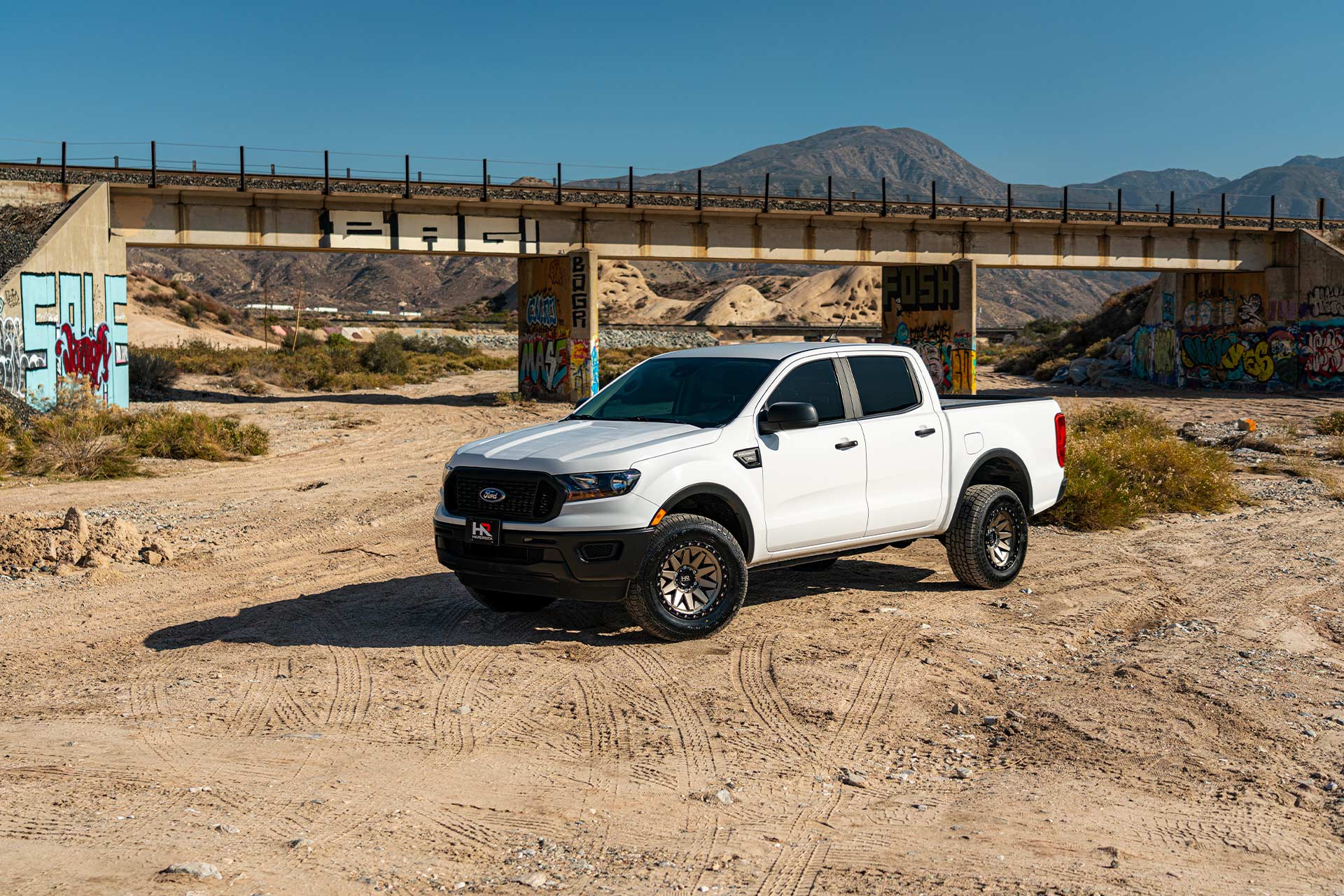 white ford ranger with matte bronze hardrock h106 off road wheels