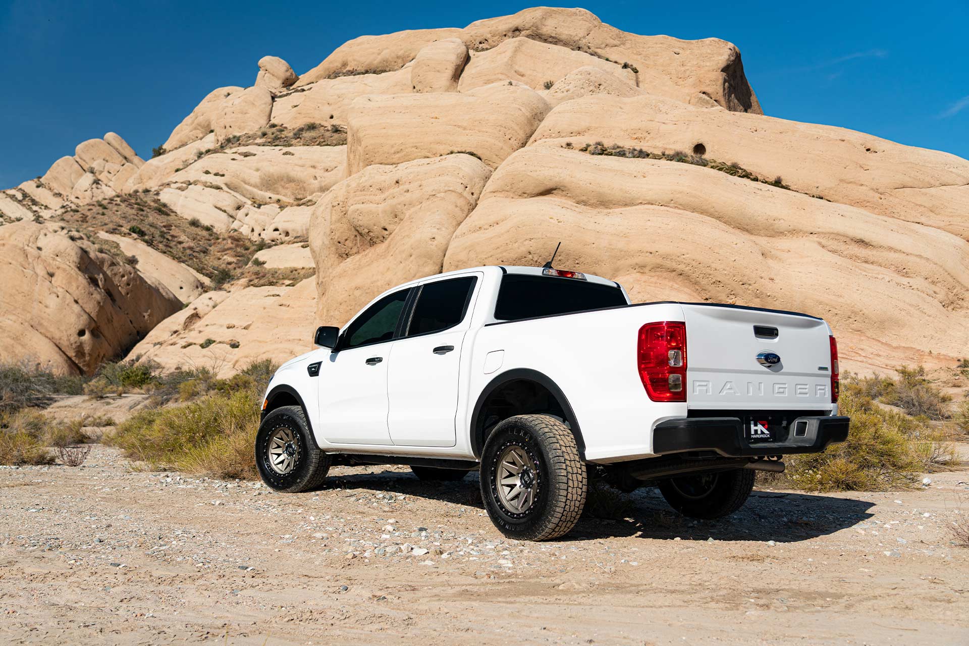 white ford ranger with matte bronze hardrock h106 off road wheels