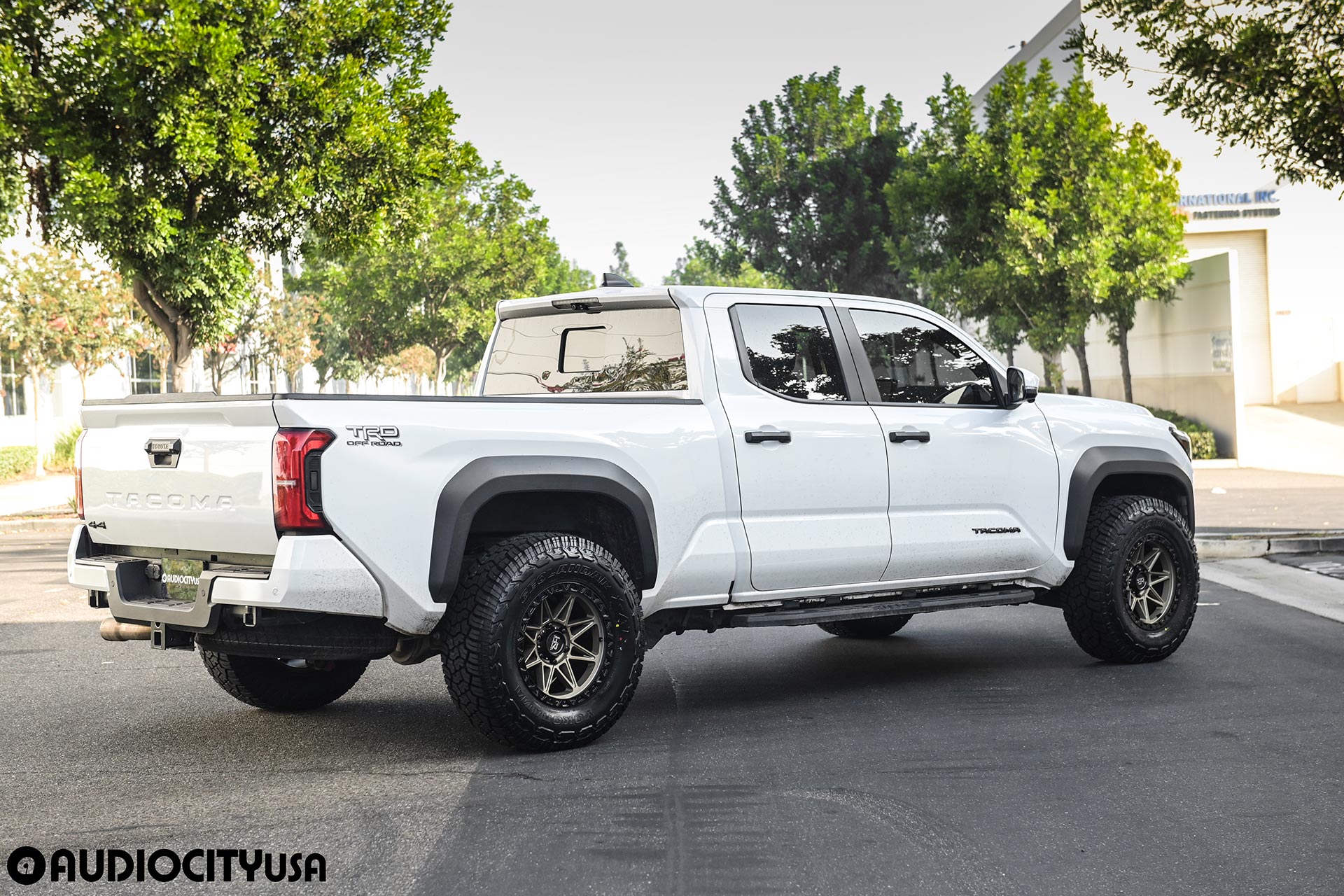 white 5th gen toyota tacoma trd off road with matte bronze hardrock offroad h109 wheels